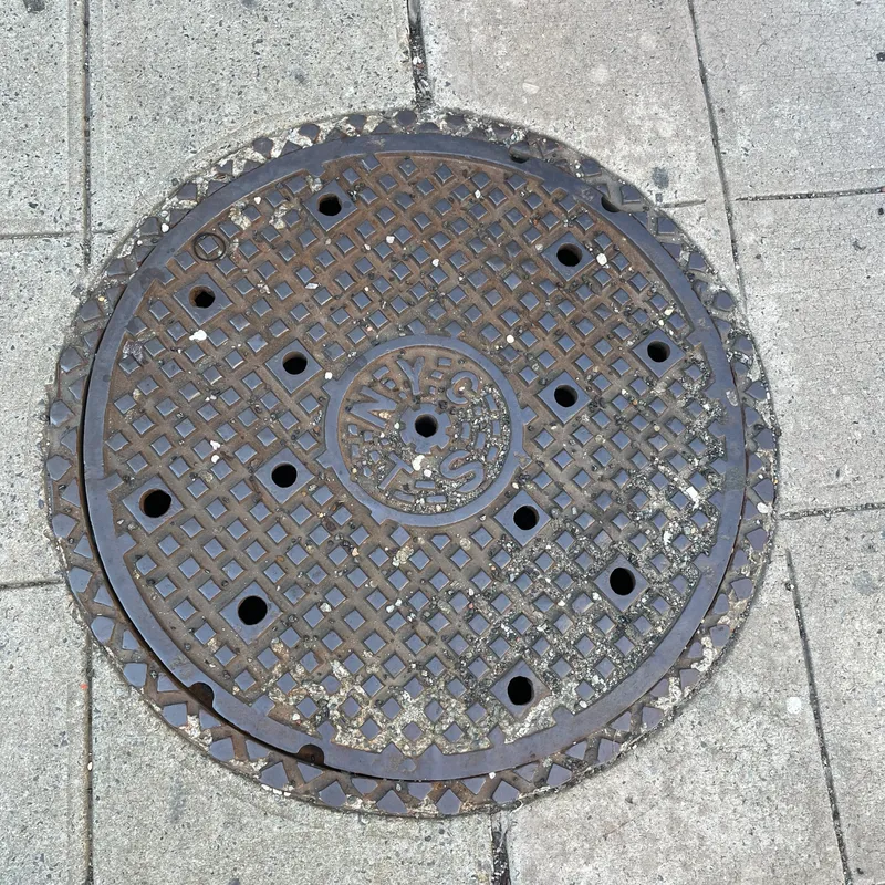 Manhole cover in New York City, United States