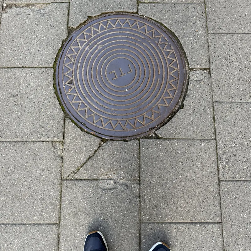 Manhole cover in Naujamiestis, Lithuania