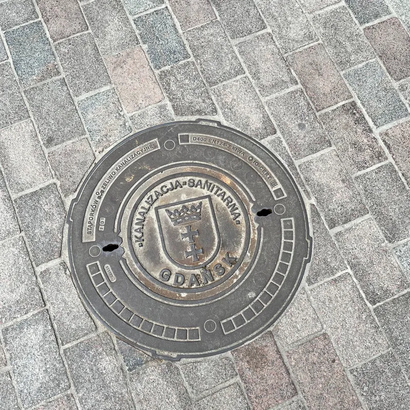 Manhole cover in Środmieście, Poland
