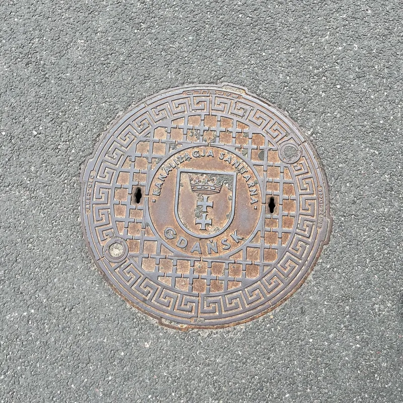 Manhole cover in Środmieście, Poland