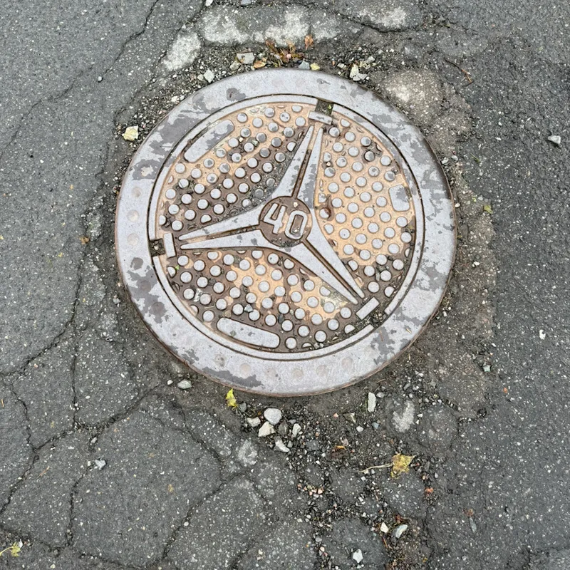 Manhole cover in Kjenn, Norway
