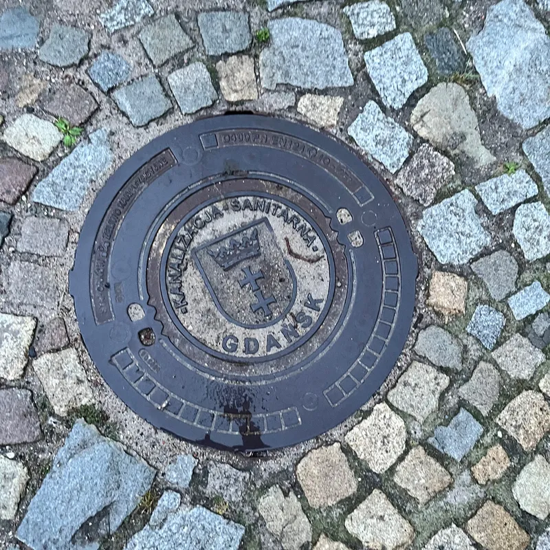 Manhole cover in Środmieście, Poland